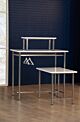 Moderne Nesting Table is crafted from high-quality materials that feature white high gloss table top and  stainless steel. or brass finished legs.  The large table is equipped with two parallel hanging bars on either side of the table, and combine seamles