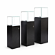 The Frameless Pedestal Showcase features locked storage area, two LED pole lights, a black laminate finish and a tempered and polished glass top. Available in 3 sizes.  