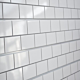 White Subway Tile with Grey Grout Textured Slatwall Panels measure 3/4''D x 2' Hx 8'L' with grooves spaced 6'' apart.  Textured slatwall panels come complete with paint matched aluminum groove inserts for added strength.  Available in white or black finis