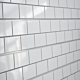 White Subway Tile with Grey Grout Textured Slatwall Panels measure 3/4''D x 2' Hx 8'L' with grooves spaced 6'' apart.  Textured slatwall panels come complete with paint matched aluminum groove inserts for added strength.  Available in white or black finis